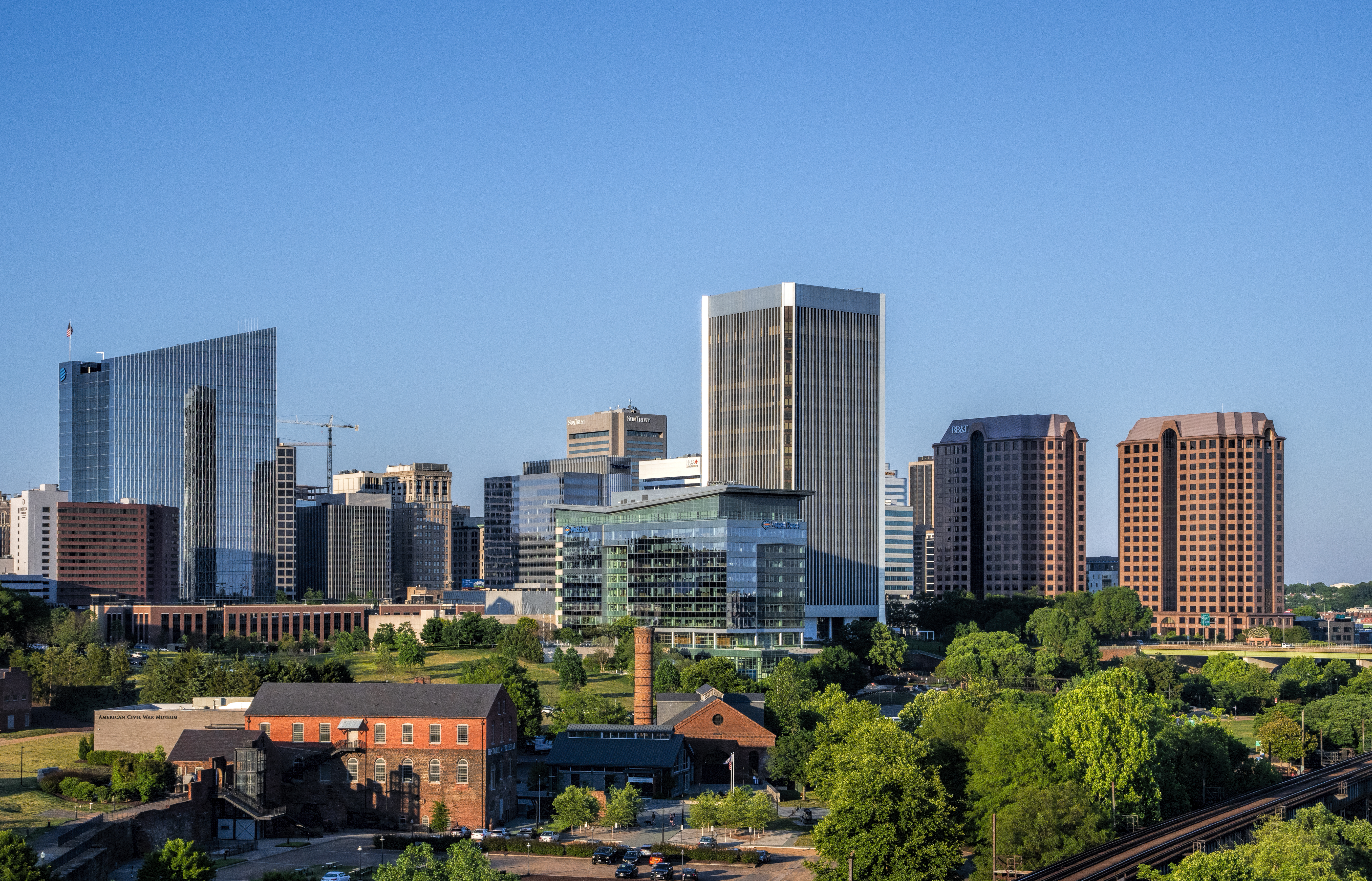 Richmond ( RICH-mənd) is the capital city of the Commonwealth of Virginia in the United States. Incorporated in 1742, Richmond has been an independent city since 1871. The city's population in the 2020 census was 226,610, up from 204,214 in 2010, making it Virginia's fourth-most populous city. The Richmond metropolitan area, with 1,260,029 people, is the Commonwealth's third-most populous.
Richmond is located at the James River's fall line, 44 mi (71 km) west of Williamsburg, 66 mi (106 km) east of Charlottesville, 91 mi (146 km) east of Lynchburg and 92 mi (148 km) south of Washington, D.C. Surrounded by Henrico and Chesterfield counties, Richmond is at the intersection of Interstate 95 and Interstate 64 and encircled by Interstate 295, Virginia State Route 150 and Virginia State Route 288. Major suburbs include Midlothian to the southwest, Chesterfield to the south, Varina to the southeast, Sandston to the east, Glen Allen to the north and west, Short Pump to the west, and Mechanicsville to the northeast.Richmond was an important village in the Powhatan Confederacy and was briefly settled by English colonists from Jamestown from 1609 to 1611. Founded in 1737, it replaced Williamsburg as the capital of the Colony and Dominion of Virginia in 1780. During the Revolutionary War period, several notable events occurred in the city, including Patrick Henry's "Give me liberty, or give me death!" speech in 1775 at St. John's Church and the passage of the Virginia Statute for Religious Freedom written by Thomas Jefferson. During the American Civil War, Richmond was the capital of the Confederate States of America. The Jackson Ward neighborhood is the city's traditional hub of African American commerce and culture, once known as the "Black Wall Street of America" and the "Harlem of the South." At the beginning of the 20th century, Richmond had one of the world's first successful electric streetcar systems.
Law, finance, and government primarily drive Richmond's economy. The downtown area is home to federal, state, and local governmental agencies as well as notable legal and banking firms. The greater metropolitan area includes several Fortune 500 companies: Performance Food Group, Altria, CarMax, Dominion Energy, Markel, Owens and Minor, Genworth Financial, and ARKO Corp. The city is home to the U.S. Court of Appeals for the 4th Circuit and a Federal Reserve Bank (one of 13 such courts and one of 12 such banks).