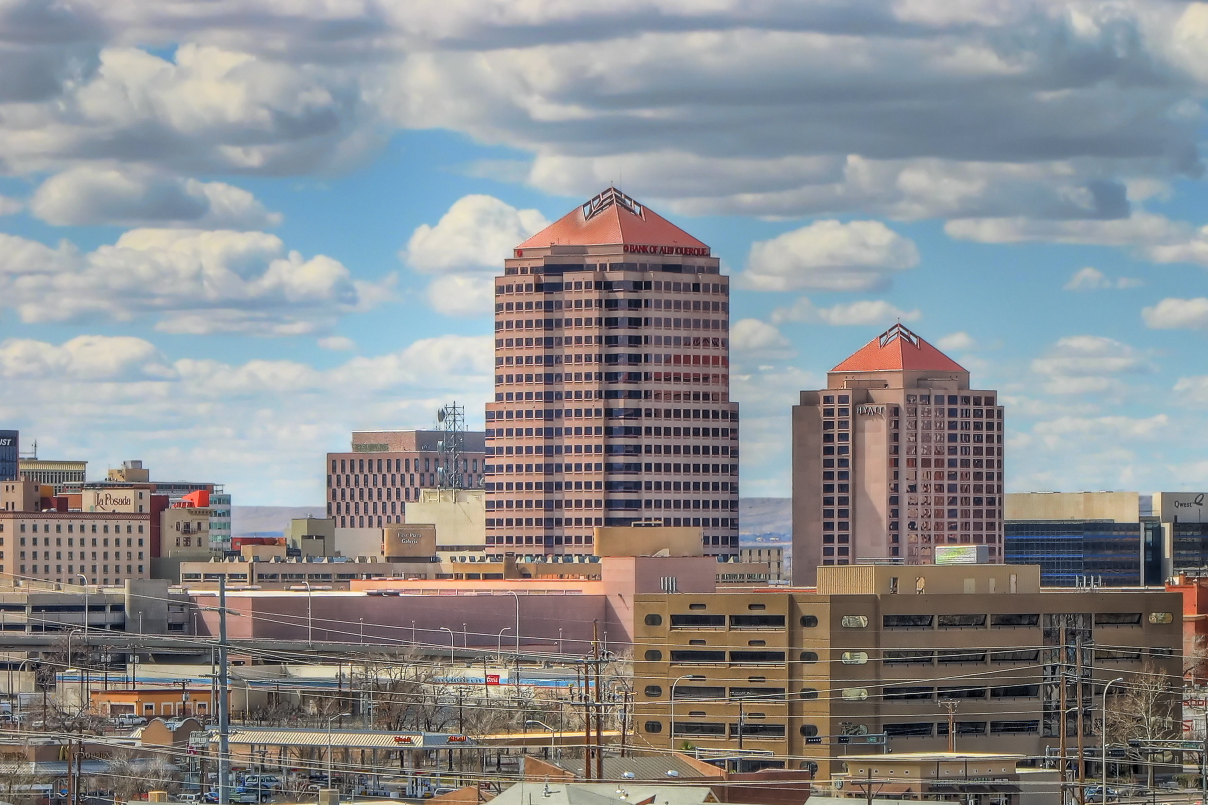 Albuquerque (  AL-bə-kur-kee; Spanish: [alβuˈkeɾke]), also known as ABQ, Burque, and the Duke City, is the most populous city in the U.S. state of New Mexico. Founded in 1706 as La Villa de Alburquerque by Santa Fe de Nuevo México governor Francisco Cuervo y Valdés, and named in honor of Francisco Fernández de la Cueva, 10th Duke of Alburquerque and Viceroy of New Spain, it served as an outpost on El Camino Real linking Mexico City to the northernmost territories of New Spain. In 2006, the city celebrated its 300th anniversary.
Located in the Albuquerque Basin, the city is flanked by the Sandia Mountains to the east and the West Mesa to the west, with the Rio Grande and bosque flowing north-to-south through the middle of the city. According to the 2020 census, Albuquerque had 564,559 residents, making it the 32nd-most populous city in the United States and the fourth largest in the Southwest. The Albuquerque metropolitan area had 955,000 residents in 2023, and forms part of the Albuquerque–Santa Fe–Las Vegas combined statistical area, which had a population of 1,162,523.Albuquerque is a hub for technology, fine arts, and media companies.  It is home to several historic landmarks, the University of New Mexico, the Albuquerque International Balloon Fiesta, the Gathering of Nations, the New Mexico State Fair, and a diverse restaurant scene, which features both New Mexican and global cuisine.