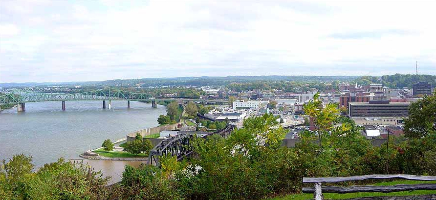 Parkersburg is a city in and the county seat of Wood County, West Virginia, United States. Located at the confluence of the Ohio and Little Kanawha rivers, it is the state's third-most populous city and the center of the Parkersburg–Vienna metropolitan area. The city's population was 29,749 at the 2020 census, and its metro population was 89,490. The city is about 14 miles (23 km) south of Marietta, Ohio.
The Baltimore and Ohio Railroad reached Parkersburg in 1857, but lacked a crossing over the Ohio River until after the American Civil War. When the B&O completed the Parkersburg Bridge (CSX) 1868–1870 to Belpre, it was the longest railroad bridge in the world.
The Bureau of the Public Debt, an agency of the U.S. Treasury Department, was relocated from the Washington, D.C. metropolitan area in the late 20th century and headquartered in Parkersburg. In October 2012, it was merged with the Financial Management Service to form the Bureau of the Fiscal Service.