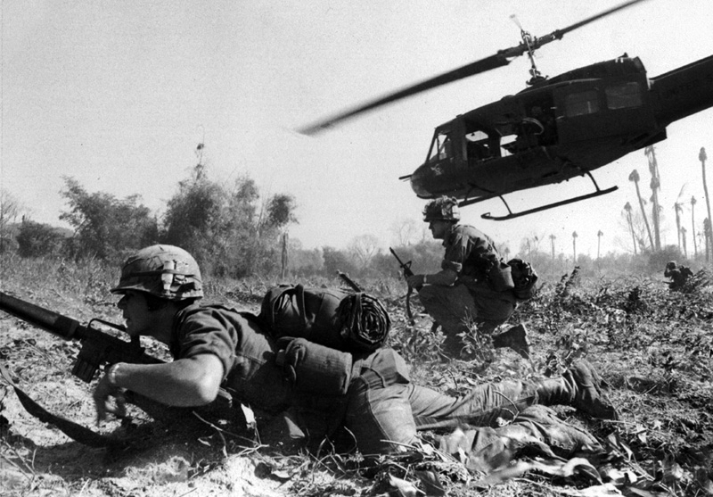 The Battle of Ia Drang (Vietnamese: Trận Ia Đrăng; Chữ Hán: 戰河德浪, [iə̯ ɗrăŋ]; in English ) was the first major battle between the United States Army and the People's Army of Vietnam (PAVN), as part of the Pleiku Campaign conducted early in the Vietnam War, at the eastern foot of the Chu Pong Massif in the central highlands of Vietnam, in 1965. It is notable for being the first large scale helicopter air assault and also the first use of Boeing B-52 Stratofortress strategic bombers in a tactical support role. Ia Drang set the blueprint for the Vietnam War with the Americans relying on air mobility, artillery fire and close air support, while the PAVN neutralized that firepower by quickly engaging American forces at very close range.
Ia Drang comprised two main engagements, centered on two helicopter landing zones (LZs), the first known as LZ X-Ray, followed by LZ Albany, farther north in the Ia Drang Valley.
LZ X-Ray involved the 1st Battalion, 7th Cavalry Regiment and supporting units under the command of Lieutenant Colonel Hal Moore, and took place November 14–16, at LZ X-Ray. Surrounded and under heavy fire from a numerically superior force, the American forces were able to drive back the North Vietnamese forces over three days, largely through the support of air power and heavy artillery bombardment, which the North Vietnamese lacked. The Americans claimed LZ X-Ray as a tactical victory, citing a 10:1 kill ratio.
The second engagement involved the 2nd Battalion, 7th Cavalry Regiment plus supporting units under the command of Lieutenant Colonel Robert McDade, and took place on November 17 at LZ Albany. When an American battalion was ambushed in close quarters, who were unable to use air and artillery support due to the close engagement of the North Vietnamese, the Americans suffered an over-50% casualty rate before being extricated. Both sides claimed victory.
The battle at LZ X-Ray was documented in the CBS special report Battle of Ia Drang Valley by Morley Safer and the critically acclaimed book We Were Soldiers Once... And Young by Hal Moore and Joseph L. Galloway. In 1994, Moore, Galloway and men who fought on both the American and North Vietnamese sides, traveled back to the remote jungle clearings where the battle took place. At the time the U.S. did not have diplomatic relations with Vietnam. The risky trip which took a year to arrange was part of an award-winning ABC News documentary, They Were Young and Brave produced by Terence Wrong. Randall Wallace depicted the battle at LZ X-Ray in the 2002 movie We Were Soldiers starring Mel Gibson and Barry Pepper as Moore and Galloway, respectively.
Galloway later described Ia Drang as "the battle that convinced Ho Chi Minh he could win".