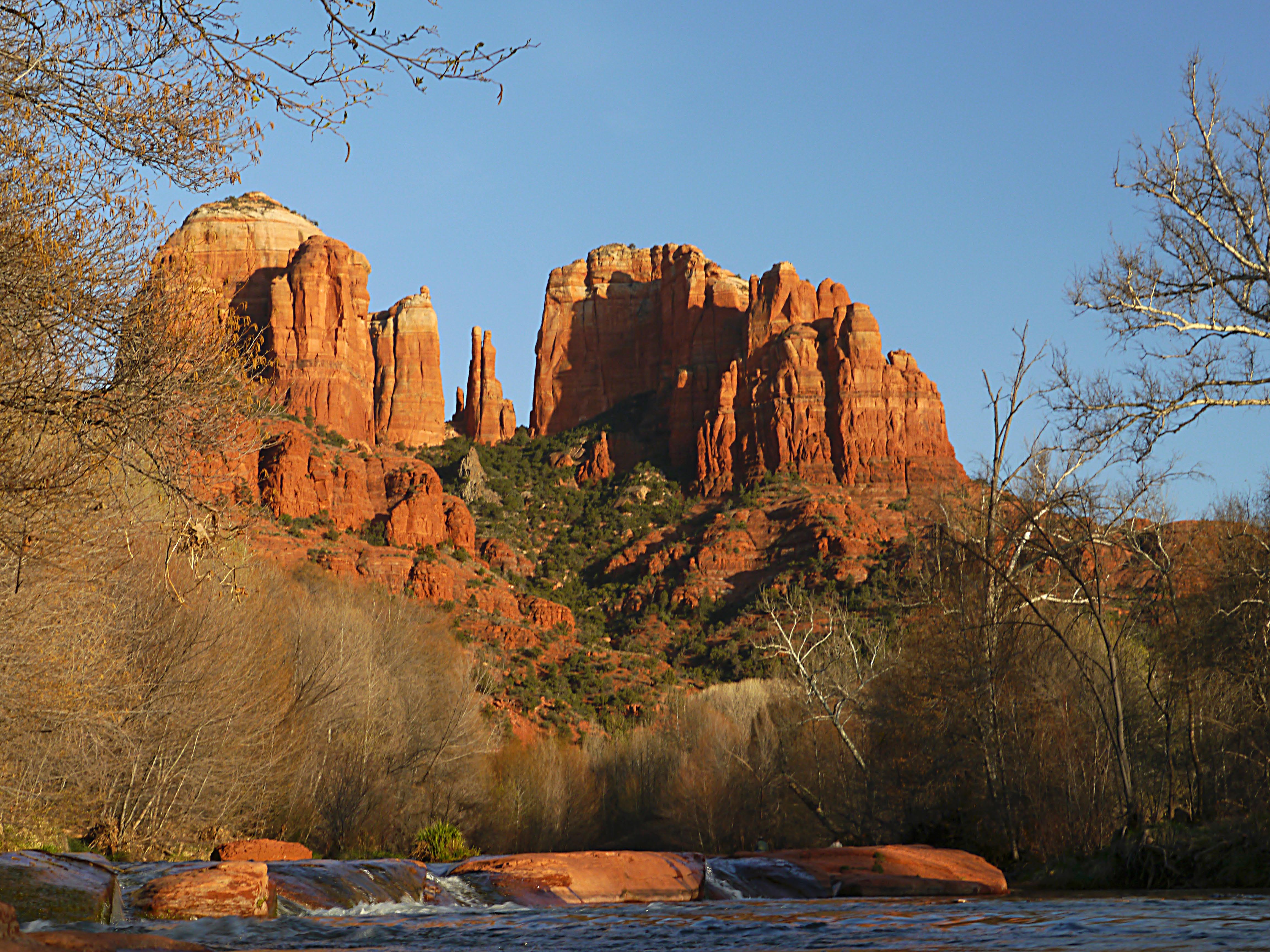 Sedona  is a city that straddles the county line between Coconino and Yavapai counties in the northern Verde Valley region of the U.S. state of Arizona. As of the 2010 census, its population was 10,031. It is within the Coconino National Forest.
Sedona's main attraction is its array of red sandstone formations. The formations appear to glow in brilliant orange and red when illuminated by the rising or setting sun. The red rocks form a popular backdrop for many activities, ranging from spiritual pursuits to the hundreds of hiking and mountain biking trails. Sedona is also the home to the nationally recognized McDonald's with turquoise arches, instead of the traditional Golden Arches.Sedona was named after Sedona Schnebly whose husband, Theodore Carlton Schnebly, was the city's first postmaster. She was celebrated for her hospitality and industriousness. Her mother, Amanda Miller, claimed to have made the name up because "it sounded pretty".