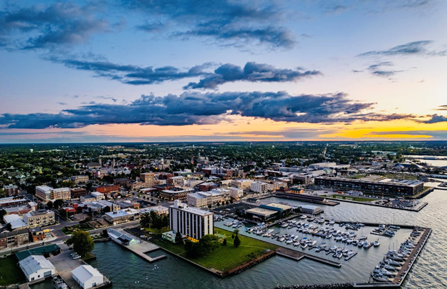 Sandusky ( san-DUSS-kee) is a city in and the county seat of Erie County, Ohio, United States. Situated along the southern shore of Lake Erie, Sandusky is located roughly midway between Toledo (45 miles (72 km) west) and Cleveland (50 miles (80 km) east). According to 2020 census, the city had a population of 25,095, and the Sandusky metropolitan area had 115,986 residents.Sandusky is home to the Cedar Fair Entertainment Company, which owns large amounts of property in Sandusky. These properties include Cedar Point, Cedar Fair's flagship park and one of the most popular amusement parks in the world, as well as Cedar Point Shores waterpark, adjacent to Cedar Point itself.In 2011, Sandusky was ranked first by Forbes magazine as the "Best Place to Live Cheaply" in the United States due to its high median family income of $64,000 compared to its relatively low cost of living. The National Arbor Day Foundation has designated Sandusky as a Tree City USA.