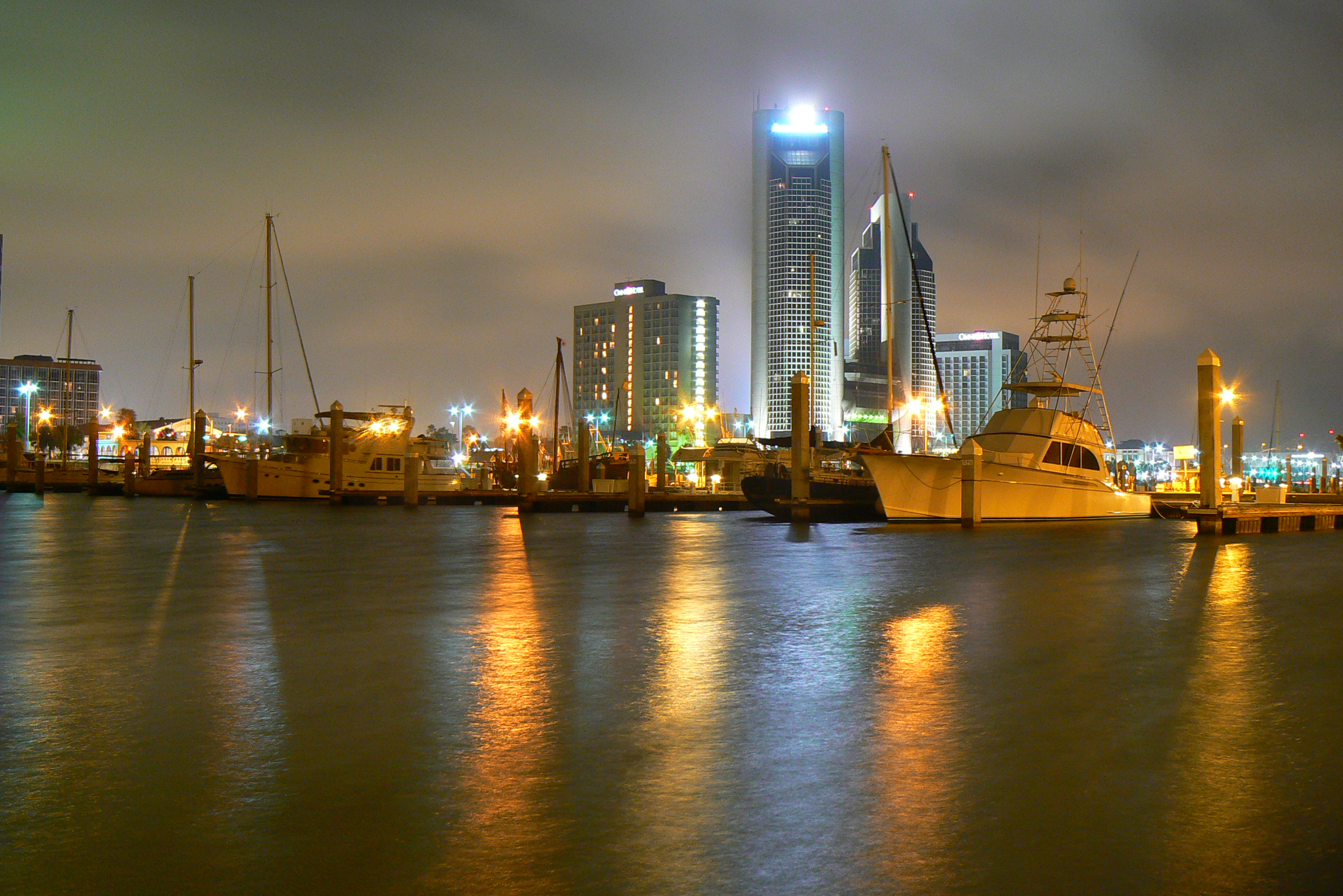 Corpus Christi ( KOR-pəs KRIS-tee; Latin for 'Body of Christ') is a coastal city in the South Texas region of the U.S. state of Texas and the county seat and largest city of Nueces County. Portions of the city also extend into Aransas, Kleberg, and San Patricio counties. It is 130 miles (210 km) southeast of San Antonio and 208 miles (335 km) southwest of Houston. Its political boundaries encompass Nueces Bay and Corpus Christi Bay. Its zoned boundaries include small land parcels or water inlets of three neighboring counties.
The city's population was 317,863 in 2020, making it the eighth-most populous city in Texas. The Corpus Christi metropolitan area had an estimated population of 442,600. It is also the hub of the six-county Corpus Christi–Kingsville combined statistical area, with a 2013 estimated population of 516,793. The Port of Corpus Christi is the fifth-largest in the United States. The region is served by the Corpus Christi International Airport.
The city's name means body of Christ in Ecclesiastical Latin, in reference to the Christian sacrament of Holy Communion. The name was given to the settlement and surrounding bay by Spanish explorer Alonso Álvarez de Pineda in 1519, as he discovered the lush semitropical bay on the Western Christian feast day of Corpus Christi.
Corpus Christi is home to Naval Air Station Corpus Christi, one of two locations training primary student pilots and advanced multiengine pilots of the US Navy, US Marine Corps, and US Coast Guard.

