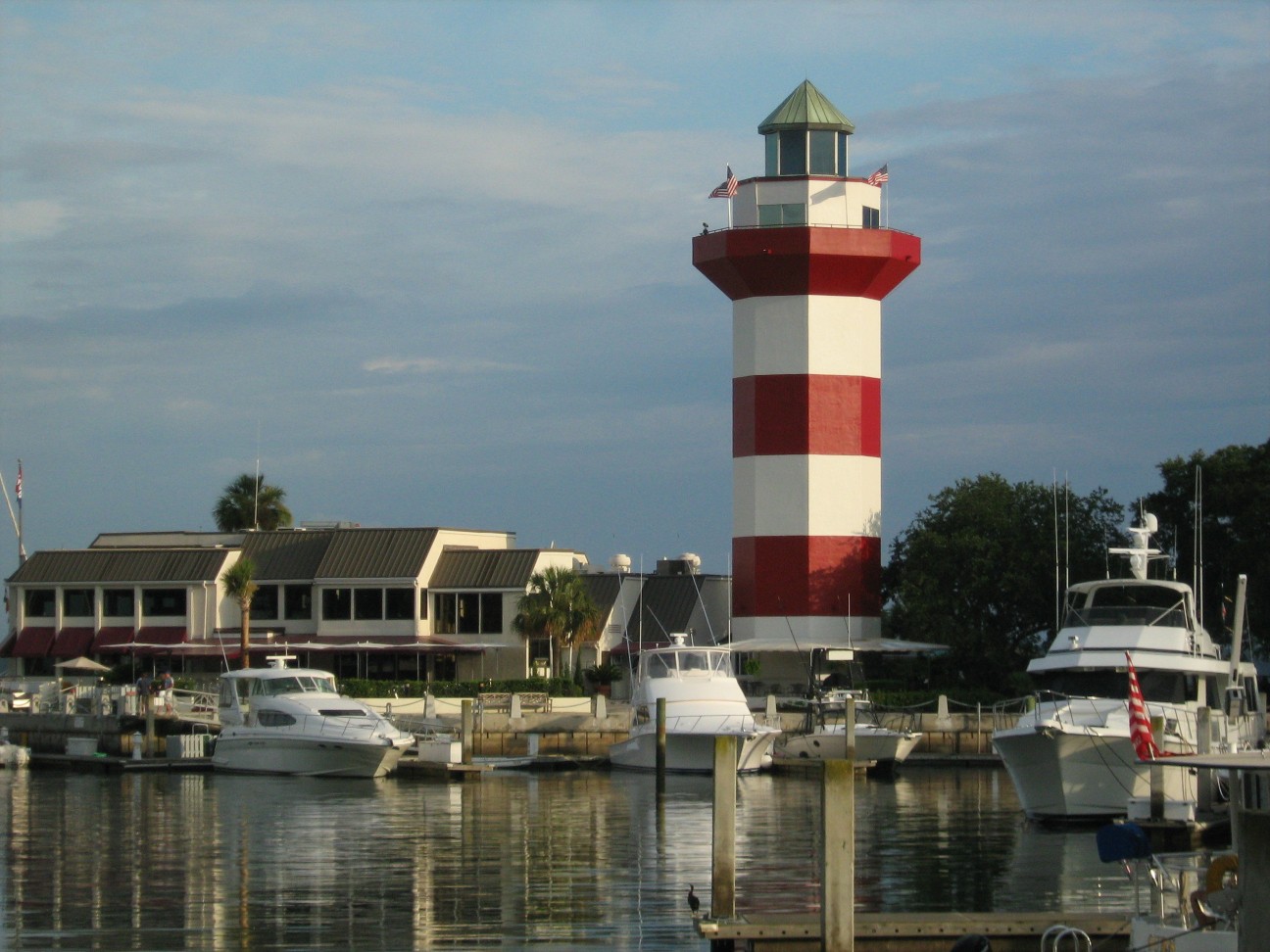 Hilton Head Island, often referred to as simply Hilton Head, is a Lowcountry resort town and barrier island in Beaufort County, South Carolina, United States. It is 20 miles (32 km) northeast of Savannah, Georgia, and 95 miles (153 km) southwest of Charleston. The island is named after Captain William Hilton, who in 1663 identified a headland near the entrance to Port Royal Sound, which mapmakers named "Hilton's Headland." The island features 12 miles (19 km) of beachfront on the Atlantic Ocean and is a popular vacation destination. In 2004, an estimated 2.25 million visitors infused more than $1.5 billion into the local economy. The year-round population was 37,661 at the 2020 census, although during the peak of summer vacation season the population can swell to 150,000. Hilton Head Island is the largest city within the Hilton Head Island-Bluffton-Port Royal, SC Metropolitan Statistical Area, which had a population of 215,908 in 2020.The island has a rich history that started with seasonal occupation by Native Americans thousands of years ago and continued with European exploration and the Sea Island Cotton trade. It became an important base of operations for the Union blockade of the Southern ports during the Civil War. Once the island fell to Union troops, hundreds of ex-slaves flocked to Hilton Head, which is still home to many of their descendants, who are known as the Gullah (or Geechee).  They have managed to hold on to much of their ethnic and cultural identity.The Town of Hilton Head Island incorporated as a municipality in 1983 and is well known for its eco-friendly development. The town's Natural Resources Division enforces the Land Management Ordinance which minimizes the impact of development and governs the style of buildings and how they are situated amongst existing trees. As a result, Hilton Head Island enjoys an unusual amount of tree cover relative to the amount of development. Approximately 70% of the island, including most of the tourist areas, is located inside gated communities. However, the town maintains several public beach access points, including one for the exclusive use of town residents, who have approved several multimillion-dollar land-buying bond referendums to control commercial growth.Hilton Head Island offers an unusual number of cultural opportunities for a community its size, including plays at the Arts Center of Coastal Carolina, the 120-member full chorus of the Hilton Head Choral Society, the Hilton Head Symphony Orchestra, an annual outdoor, tented wine tasting event on the east coast, and several other annual community festivals. It also hosts the RBC Heritage, a PGA Tour tournament played on the Harbour Town Golf Links in Sea Pines Resort.