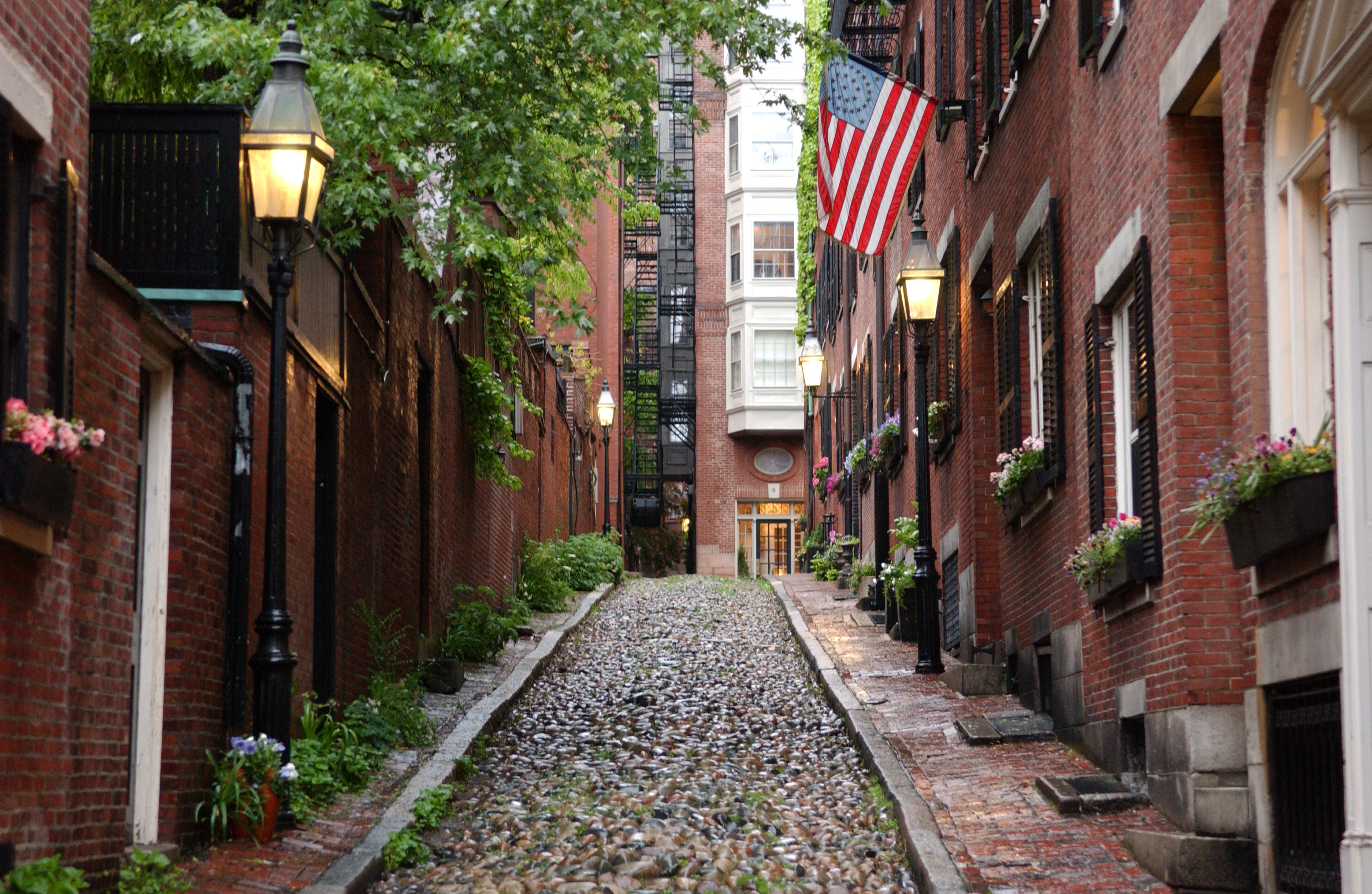 Boston (US: ), officially the City of Boston, is the capital and most populous city in the Commonwealth of Massachusetts, and is the cultural and financial center of New England in the Northeastern United States, with an area of 48.4 sq mi (125 km2) and a population of 675,647 in 2020. The Greater Boston metropolitan statistical area is the eleventh-largest in the country.Boston is one of the United States' oldest municipalities. It was founded on the Shawmut Peninsula in 1630 by Puritan settlers from Boston, Lincolnshire. During the American Revolution, Boston was the location of several key events, including the Boston Massacre, the Boston Tea Party, the hanging of Paul Revere's lantern signal in Old North Church, the Battle of Bunker Hill, and the siege of Boston. Following American independence from Great Britain, the city continued to play an important role as a port, manufacturing hub, and center for education and culture. The city has expanded beyond the original peninsula through land reclamation and municipal annexation. It now attracts many tourists, with Faneuil Hall alone drawing more than 20 million visitors per year. Boston's many firsts include the United States' first public park (Boston Common, 1634), the first public school (Boston Latin School, 1635), the first subway system (Tremont Street subway, 1897), and the first large public library (Boston Public Library, 1848).
In the 21st century, Boston emerged as a global leader in higher education and academic research. Greater Boston's many colleges and universities include Harvard University and MIT, both located in neighboring Cambridge and both routinely included among the world's most highly ranked universities. Boston has become the largest biotechnology hub in the world. The city is also a national leader in scientific research, law, medicine, engineering, and business. With nearly 5,000 startup companies, the city is considered a global pioneer in innovation and entrepreneurship, and more recently in artificial intelligence. Boston's economic base also includes finance, professional and business services, information technology, and government activities. Households in the city claim the highest average rate of philanthropy in the United States. Boston businesses and institutions rank among the top in the country for environmental sustainability and new investment.