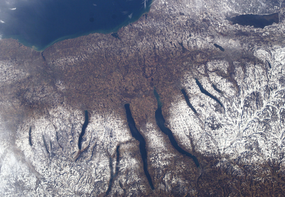 The Finger Lakes are a group of eleven long, narrow, roughly north–south lakes located directly south of Lake Ontario in an area called the Finger Lakes region in New York, in the United States. This region straddles the northern and transitional edge of the Northern Allegheny Plateau, known as the Finger Lakes Uplands and Gorges ecoregion, and the Ontario Lowlands ecoregion of the Great Lakes Lowlands.The geological term finger lake refers to a long, narrow lake in an overdeepened glacial valley, while the proper name Finger Lakes goes back to the late 19th century. Cayuga and Seneca Lakes are among the deepest in the United States, measuring 435 feet (133 m) and 618 feet (188 m), respectively, with bottoms well below sea level. Though none of the lakes' widths exceed 3.5 miles (5.6 km), Seneca Lake is 38.1 miles (61.3 km) long, and at 66.9 square miles (173 km2) is the largest in total area.