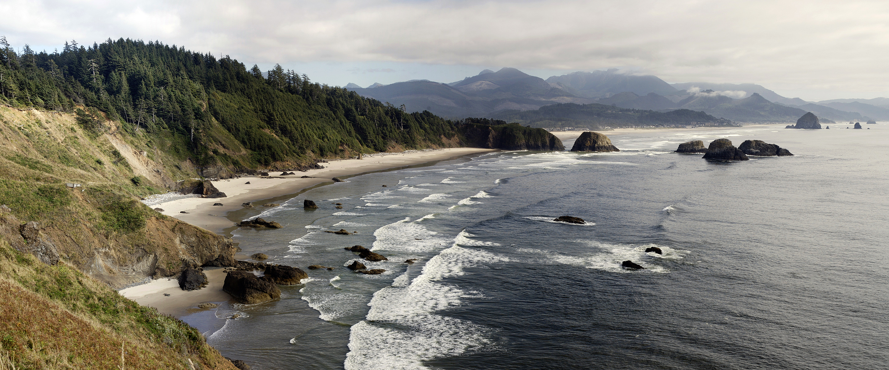 The Oregon Coast is a coastal region of the U.S. state of Oregon. It is bordered by the Pacific Ocean to its west and the Oregon Coast Range to the east, and stretches approximately 362 miles (583 km) from the California state border in the south to the Columbia River in the north. The region is not a specific geological, environmental, or political entity, and includes the Columbia River Estuary.
The Oregon Beach Bill of 1967 allows free beach access to everyone. In return for a pedestrian easement and relief from construction, the bill eliminates property taxes on private beach land and allows its owners to retain certain beach land rights.Traditionally, the Oregon Coast is regarded as three distinct sub–regions:
The North Coast, which stretches from the Columbia River to Cascade Head.
The Central Coast, which stretches from Cascade Head to Reedsport.
The South Coast, which stretches from Reedsport to the Oregon–California border.The largest city is Coos Bay, population 16,700 in Coos County on the South Coast. U.S. Route 101 is the primary highway from Brookings to Astoria and is known for its scenic overlooks of the Pacific Ocean. Over 80 state parks and recreation areas dot the Oregon Coast. However, only a few highways cross the Coast Range to the interior: US 30, US 26, OR 6, OR 22,US 20, OR 18, OR 34, OR 126, OR 38, and OR 42. OR 18 and US 20 are considered among the dangerous roads in the state.The Oregon Coast includes Clatsop County, Tillamook County, Lincoln County, western Lane County, western Douglas County, Coos County, and Curry County.