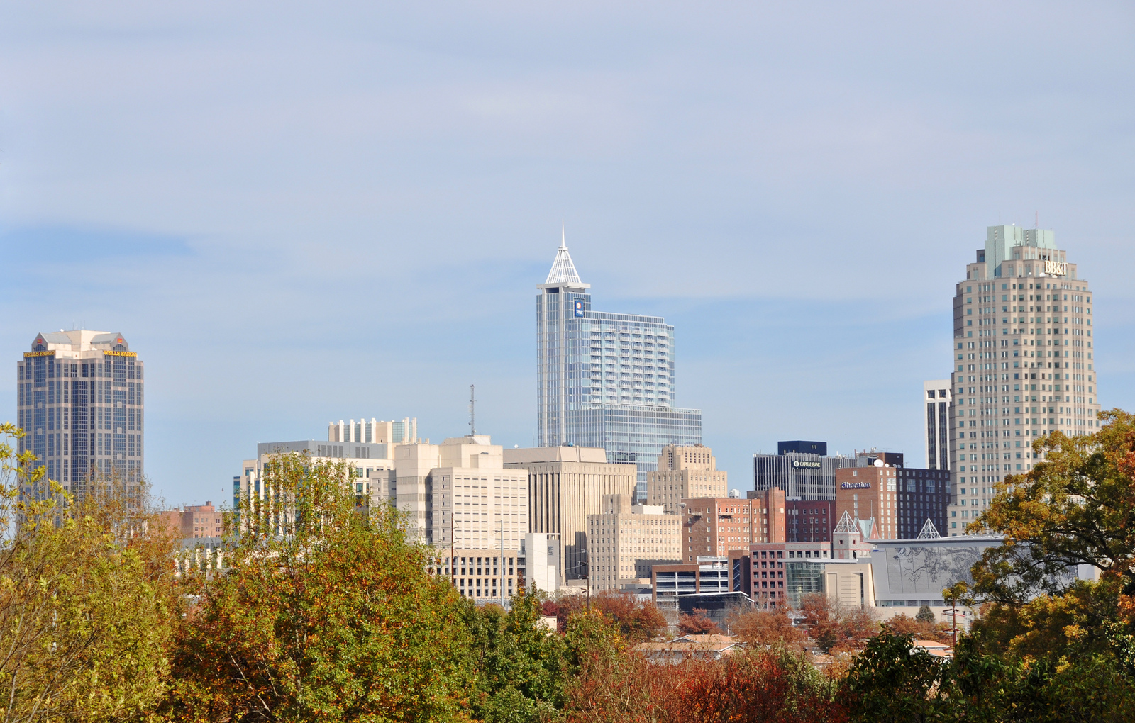 The Research Triangle, or simply The Triangle, are both common nicknames for a metropolitan area in the Piedmont region of the U.S. state of North Carolina. Anchored by the cities of Raleigh and Durham and the town of Chapel Hill, the region is home to three major research universities: North Carolina State University, Duke University, and the University of North Carolina at Chapel Hill, respectively. The "Triangle" name originated in the 1950s with the creation of Research Triangle Park located between the three anchor cities, which is the largest research park in the United States and home to numerous high tech companies.The nine-county region, officially named the Raleigh-Durham-Cary, NC Combined Statistical Area by the Office of Management and Budget, comprises the Raleigh-Cary, Durham-Chapel Hill, and Henderson, NC Metropolitan Statistical Areas. The 2020 census put the population of the area at 2,106,463, making it the second-largest combined statistical area in North Carolina, behind Charlotte. The Raleigh–Durham television market includes a broader 24-county area which includes Fayetteville, North Carolina, and has a population of 2,726,000 persons. Most of the Triangle is part of North Carolina's first, second, fourth, ninth, and thirteenth congressional districts.The region is sometimes confused with the Piedmont Triad, which is a North Carolina region adjacent to and directly west of the Triangle comprising Greensboro, Winston-Salem, and High Point, among other cities.