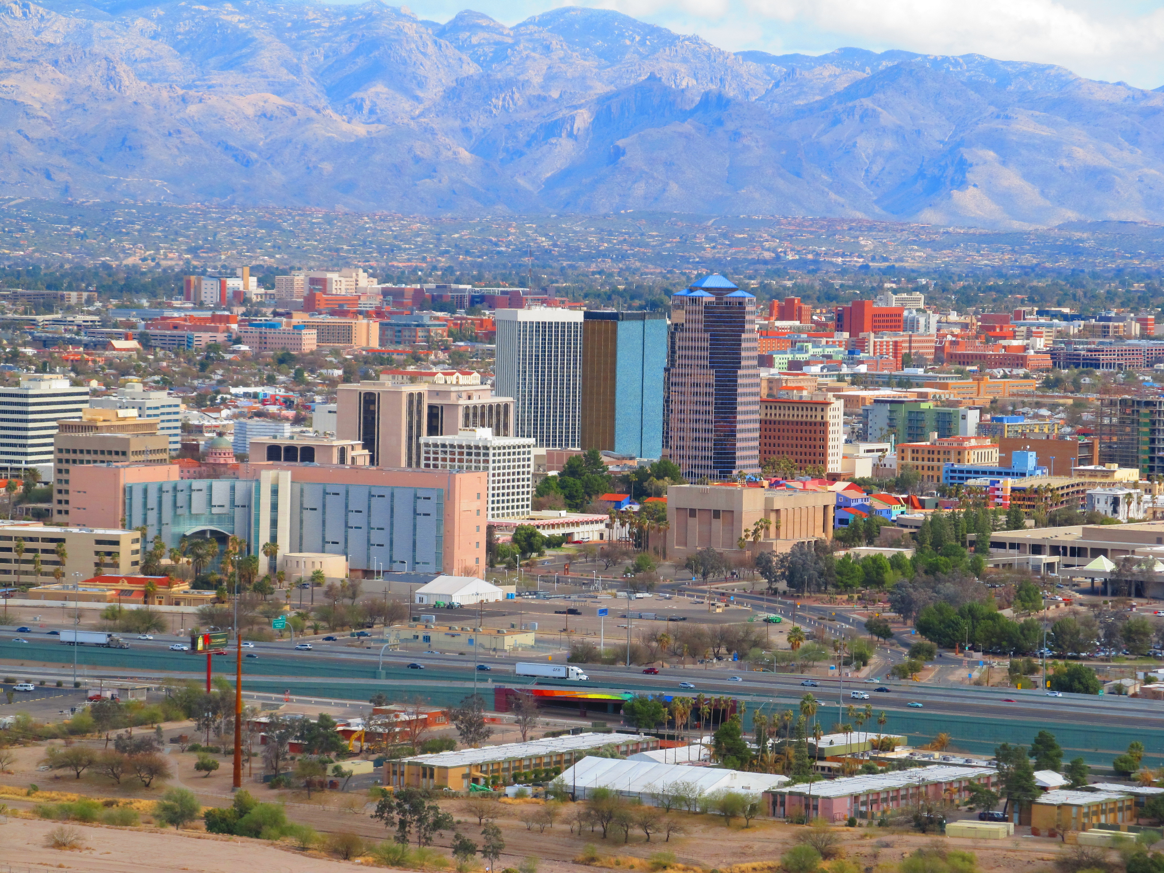 Tucson (; O'odham: Cuk Ṣon) is a city in and the county seat of Pima County, Arizona, United States, and is home to the University of Arizona. It is the second-largest city in Arizona behind Phoenix, with a population of 542,629 in the 2020 United States census, while the population of the entire Tucson metropolitan statistical area (MSA) is 1,043,433. The Tucson MSA forms part of the larger Tucson-Nogales combined statistical area. Both Tucson and Phoenix anchor the Arizona Sun Corridor. The city is 108 miles (174 km) southeast of Phoenix and 60 mi (100 km) north of the United States–Mexico border. Tucson is the 33rd most populous city and the 53rd largest metropolitan area in the United States (2014).
Major incorporated suburbs of Tucson include Oro Valley and Marana northwest of the city, Sahuarita south of the city, and South Tucson in an enclave south of downtown. Communities in the vicinity of Tucson (some within or overlapping the city limits) include Casas Adobes, Catalina Foothills, Flowing Wells, Midvale Park, Tanque Verde, Tortolita, and Vail. Towns outside the Tucson metropolitan area include Benson to the southeast, Catalina and Oracle to the north, and Green Valley to the south.
Tucson was founded as a military fort by the Spanish when Hugo O'Conor authorized the construction of Presidio San Agustín del Tucsón in 1775. It was included in the state of Sonora after Mexico gained independence from the Spanish Empire in 1821. The United States acquired a 29,670 square miles (76,840 km2) region of present-day southern Arizona and southwestern New Mexico from Mexico under the Gadsden Purchase in 1853. Tucson served as the capital of the Arizona Territory from 1867 to 1877. Tucson was Arizona's largest city by population during the territorial period and early statehood, until it was surpassed by Phoenix by 1920. Nevertheless, its population growth remained strong during the late 20th century. Tucson was the first American city to be designated a "City of Gastronomy" by UNESCO in 2015.The Spanish name of the city, Tucsón (Spanish pronunciation: [tukˈson]), is derived from the O'odham Cuk Ṣon (Uto-Aztecan pronunciation: [tʃʊk ʂɔːn]). Cuk is a stative verb meaning "(be) black, (be) dark". Ṣon is (in this usage) a noun referring to the base or foundation of something. The name is commonly translated into English as "(at the) base of the black [hill]", a reference to a basalt-covered hill now known as Sentinel Peak. Tucson is sometimes referred to as the Old Pueblo and Optics Valley, the latter referring to its optical science and telescopes known worldwide.